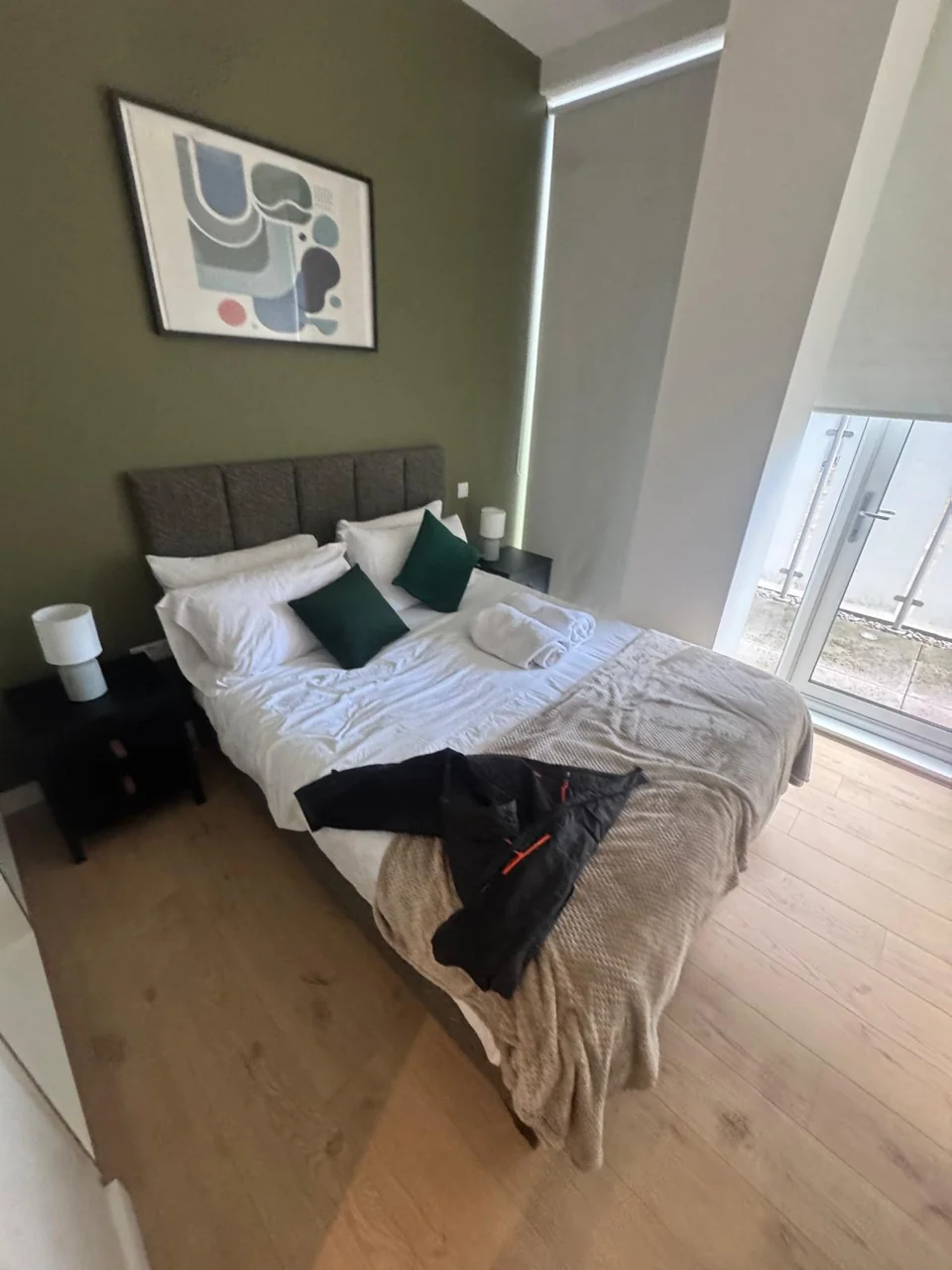 Brentford bedroom before the guest changeover, with unmade bedding