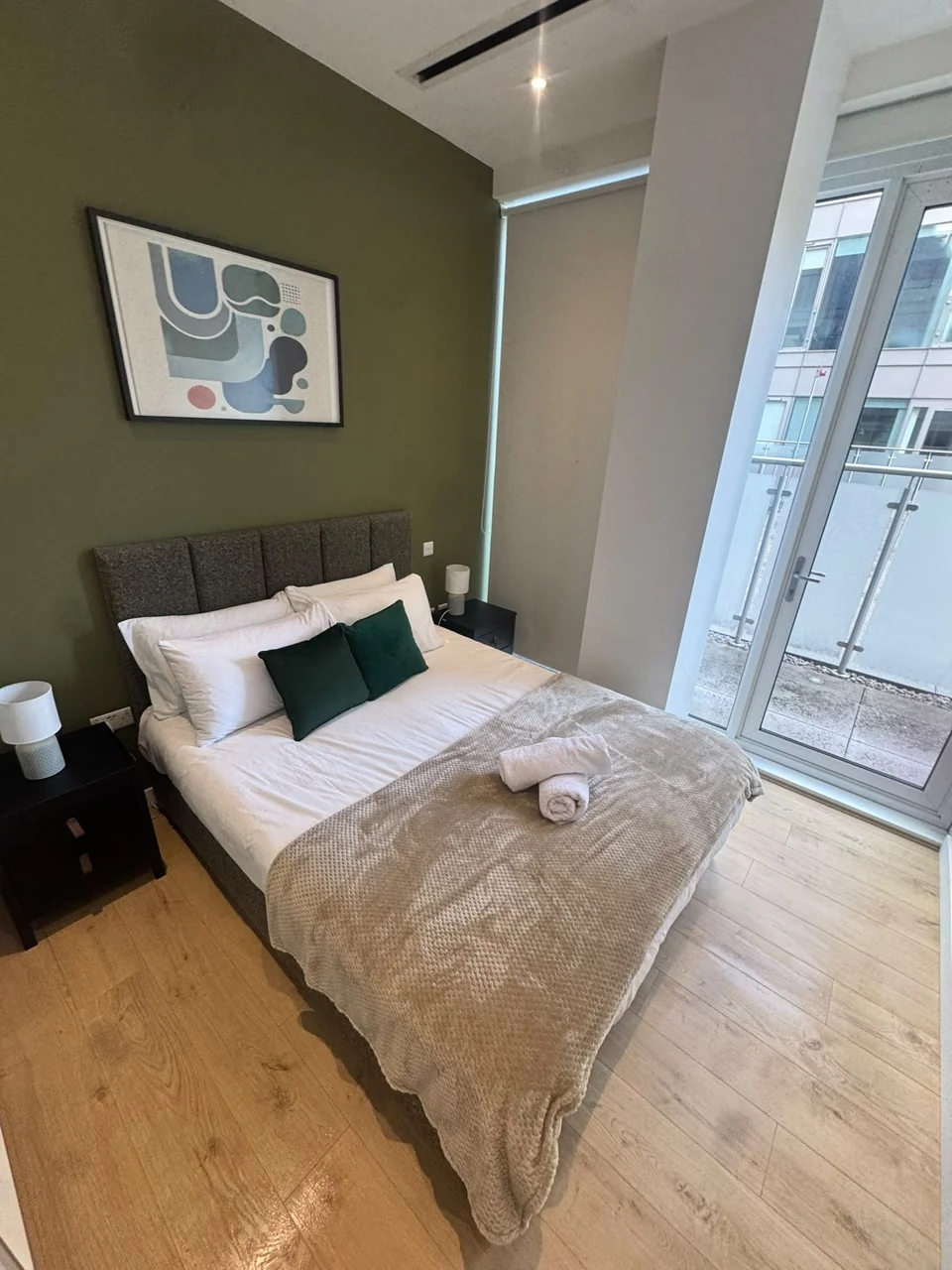 Guest-ready Brentford bedroom with folded towels